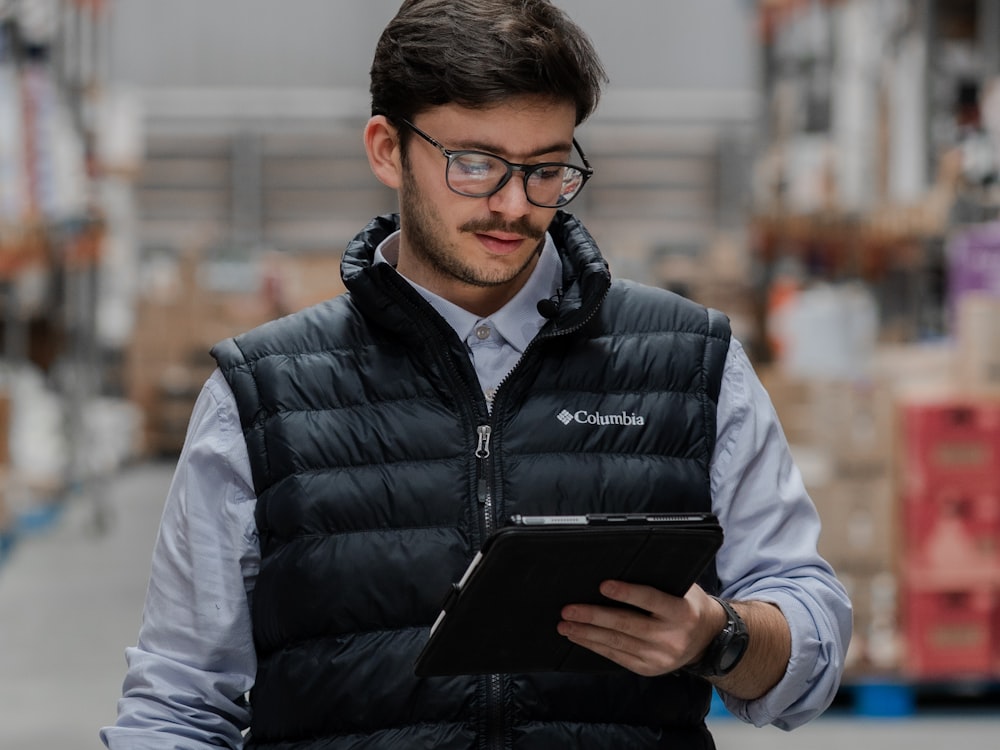 A StrongBox staff member scanning the QR label on a storage box with a handheld device